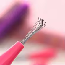 Metal comb for cleaning hairbrush