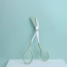 Eyebrow trimming scissors with built-in comb
